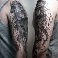 Unbelievable painted natural looking black ink jellyfish tattoo on arm