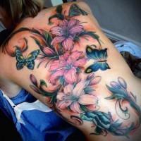 Unbelievable painted realistic looking colored floral tattoo with butterflies on whole back