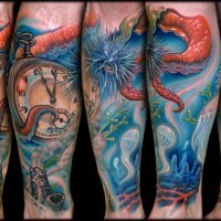 Underwater themed colorful leg tattoo of old clock and jellyfish