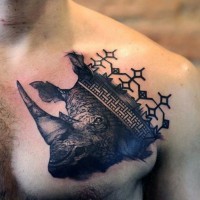 Unique black ink chest tattoo of rhino head with medieval ornaments