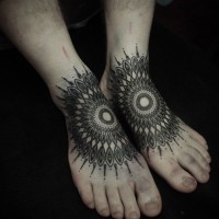 Unique designed black and white Hinduism style sun tattoo on feet
