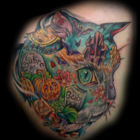 Unique designed cat head tattoo stylized with creepy Halloween cemetery