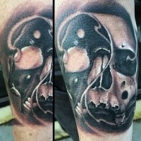 Unique designed Yin Yang symbol shaped human skull tattoo