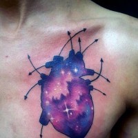 Unique like space colored heart tattoo on chest