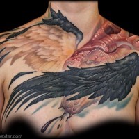 Unique multicolored chest tattoo of detailed human heart with wings