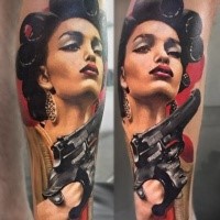 Unique painted and colored leg tattoo of seductive woman with pistol