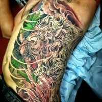 Unique style half colored lion in jungle tattoo on side