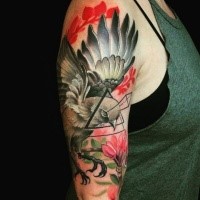 New school style colored shoulder tattoo of flying bird with triangle