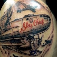 Illustrative style colored shoulder tattoo of WW2 bomber plane