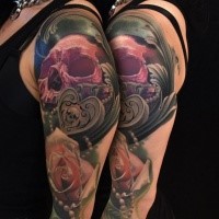 Illustrative style colored shoulder tattoo of red skull with rose and jewelry