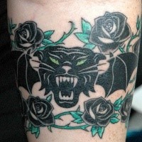 Illustrative style colored arm tattoo of big black panther with bat wings and roses