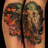 New school style colored leg tattoo of amazing looking animal skull with flames