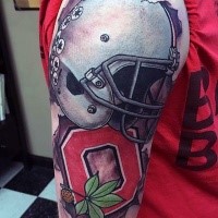 New school style colored shoulder tattoo of America football helmet with lettering