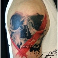 Illustrative style colored shoulder tattoo of human skull with red lines