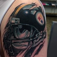 New school style colored shoulder tattoo of American football player helmet