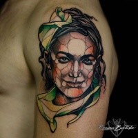 Illustrative style colored shoulder tattoo of smiling woman face