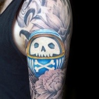Illustrative style colored shoulder tattoo of daruma doll with crossed bones and flowers