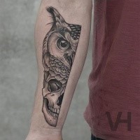 Unreal looking black ink forearm tattoo of split owl and human head by Valentin Hirsch