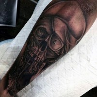 Unusual black and white skull in hat tattoo on arm