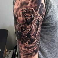 Unusual black ink corrupted angel tattoo on shoulder with flashes