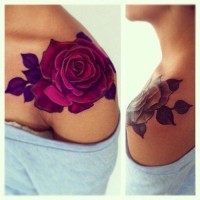 Unusual colored big rose tattoo on shoulder