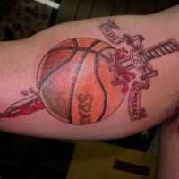 Unusual combined and colored biceps tattoo of basketball with samurai sword and lettering