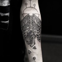 Unusual combined black and white skeleton with wings and broken stone tattoo on arm
