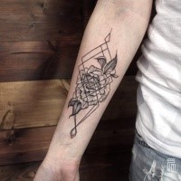 Unusual combined black ink flower tattoo on forearm with geometrical figures