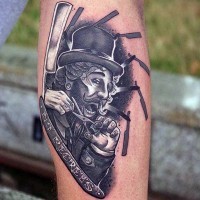 Unusual combined funny man with scissors and razor blade tattoo on arm