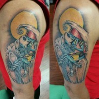 Unusual designed and colored arm tattoo of kissing monster couple