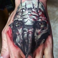 Unusual designed and colored hand tattoo of creepy monster face