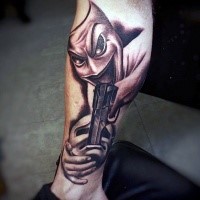 Unusual designed and colored leg tattoo of happy mask with pistol combined with sad mask