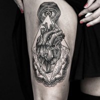 Unusual designed big black and white mystical cult tattoo on thigh