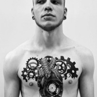 Unusual designed black and white chest tattoo of mechanical heart