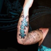 Unusual designed black ink puzzle tattoo on sleeve combined with dragon skin