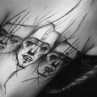 Unusual designed black ink upper arm tattoo of mystical mask by Inez Janiak
