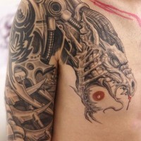 Unusual designed very detailed colored chest and shoulder tattoo of biomechanical dragon