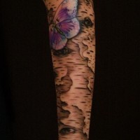 Unusual gray-ink bark and violet butterfly tattoo sleeve on forearm