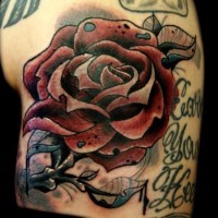 Unusual painted big colored rose tattoo on shoulder