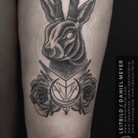 Unusual style designed black and white deer with cult symbols tattoo on thigh