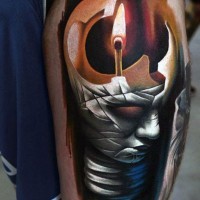 Unusual style designed colored mystical statue with match tattoo on thigh
