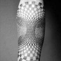 Usual black and white hypnotic ornament tattoo on arm