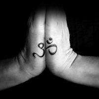 Usual black ink Hinduism symbol tattoo on hands