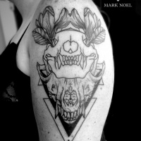 Usual black ink shoulder tattoo of animal skull with flowers