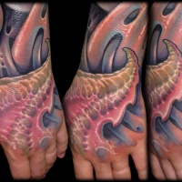 Usual designed hand colored tattoo of alien like leaves