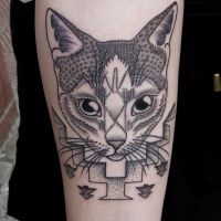 Usual dot style forearm tattoo of cat with geometrical ornaments