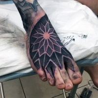 Usual dotwork style on foot tattoo of floral ornament