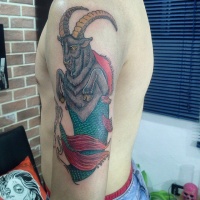 Usual painted colorful shoulder tattoo of fantasy Capricorn