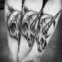 Usual sketch style black ink forearm tattoo by Inez Janiak of unicorn skull