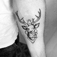Usual style black ink deer head combined with geometrical figures tattoo on forearm zone